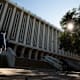 A student walks past Langson Library on the University of California campus in Irvine, CA.