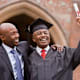 African man hugging graduate father