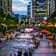 Residents relaxing by Cheonggyecheon Stream in the Central Business District of Seoul, South Korea, at night.