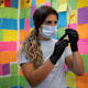 A healthcare worker prepares a dose of a Covid-19 booster vaccine at a pharmacy in Schwenksville, Pennsylvania.