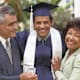 Male student with parents, outdoors, portrait