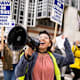 Los Angeles, CA - December 01:Gloria Bartolo, a 2nd year molecular biology PhD student, leads marching UCLA postdoctoral scholars and academic researchers in Westwood as they demand better wages, student housing, child care and more with University of California on Thursday, December 1, 2022 as contract negotiations continue and thousands strike. (Photo by Sarah Reingewirtz/MediaNews Group/Los Angeles Daily News via Getty Images)
