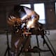 BOSTON, MA - OCTOBER 2: A welder works on a pipe fitting at the new Fraunhofer Building Technology Showcase October 2, 2012 under construction in the Innovation District of Boston, Massachusetts. Included in the building will be the Fraunhofer Center for Sustainable Energy Systems, a testing area for building related industrial firms testing their new systems of sustainable technologies, materials and concepts and monitored by Fraunhofer's Research &amp; Design engineers. Part of the testing facility will include a Building Energy Efficiency Group which works to accelerate development of the next-generation of energy-saving building technologies and practices. The Fraunhofer Institute is Europe's largest applied research organization with over 20,000 staff and offices in Europe, U.S.A., Asia and the Middle East. (Photo by Robert Nickelsberg/Getty Images)