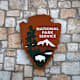 The logo of the National Park Service is affixed to the front of the visitor center