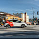 A Cruise autonomous vehicle driving down a busy street