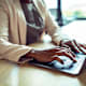 A close up of a bootcamp student working on her laptop.