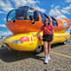 Emily Schmitt standing in front of the Frankmobile