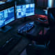 Person looking at surveillance cameras on computer monitors