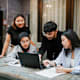 Asian students in the university are presenting to their friends.