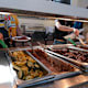 Students take food from a self-serve tray at the Clark Kerr dining hall on the University of California, Berkeley campus on August 30, 2022.