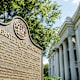 A historic marker sign on the University of Georgia campus, North Campus Quad, in downtown Athens, Georgia.