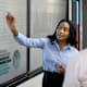 A Latin American MBA instructor using a visual aid to clarify educational concepts for a student.