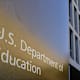 A sign marks the location of the U.S. Department of Education headquarters building