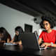 student-sits-at-desk-working