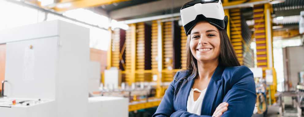 Young woman working in distribution warehouse, wearing VR glasses