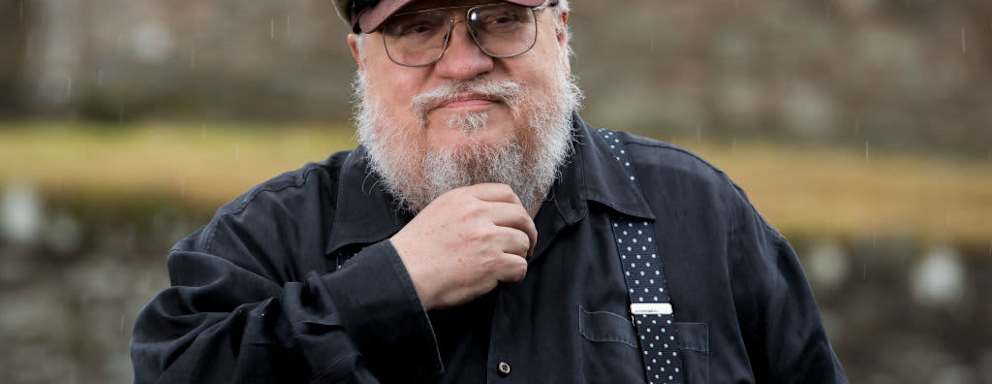 George R. R. Martin, American novelist and short story writer, best known for his series of epic fantasy novels, A Song of Ice and Fire, which was adapted into the HBO series Game of Thrones stands at fictional Winterfell Castle in the grounds of the National Trust property, Castle Ward, where scenes from the series were filmed, before an audience with George at Castle WardÕs theatre this evening. (Photo by Liam McBurney/PA Images via Getty Images)