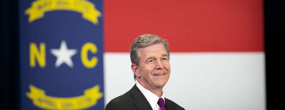 GREENSBORO, NC - APRIL 14: North Carolina Governor Roy Cooper is seen before President Joe Biden speaks to guests during a visit to North Carolina Agricultural and Technical State University on April 14, 2022 in Greensboro, North Carolina. Biden was in North Carolina to discuss his administration's efforts to create manufacturing jobs and alleviate the impacts of inflation. (Photo by Allison Joyce/Getty Images)