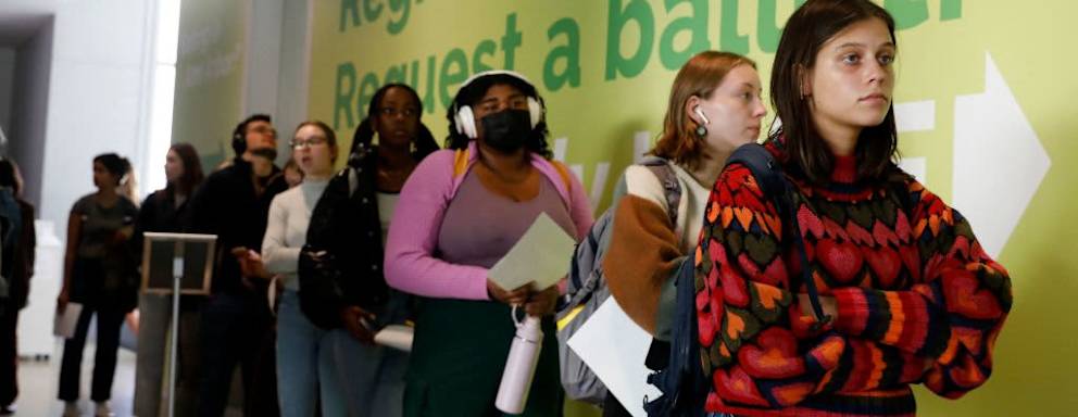 People line up to cast their early ballots for the 2022 general election at the Ann Arbor, Michigan city clerk's satellite office on the campus of the University of Michigan, on the eve of the US midterm elections, on November 7, 2022. (Photo by JEFF KOWALSKY / AFP) (Photo by JEFF KOWALSKY/AFP via Getty Images)