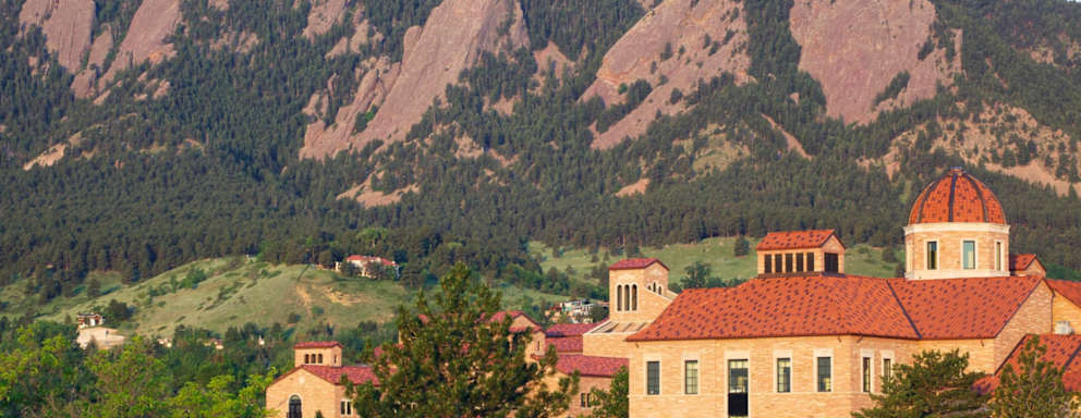 The flatirons behind a classroom building on the University of Colorado campus in Boulder Colorado.