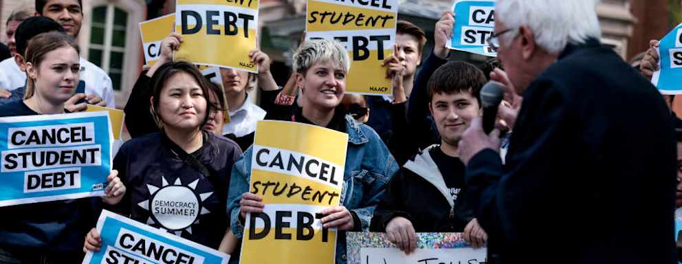 WASHINGTON, DC - APRIL 27: Activists listen as Sen. Bernie Sanders (I-VT) speaks at a Student Loan Forgiveness rally on Pennsylvania Avenue and 17th street near the White House on April 27, 2022 in Washington, DC. Student loan activists including college students held the rally to celebrate U.S. President Joe Biden's extension of the pause on student loans and also urge him to sign an executive order that would fully cancel all student debt. (Photo by Anna Moneymaker/Getty Images)