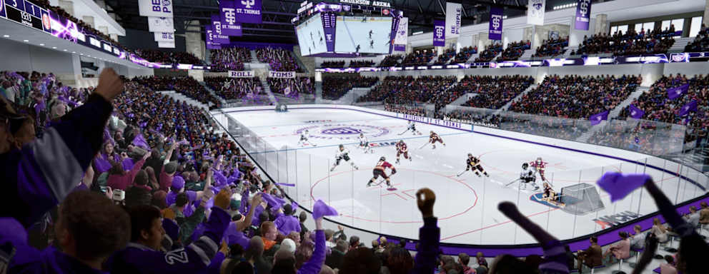 A picture of a University St. Thomas Hockey game. The picture is taken from a spot in the bleachers.