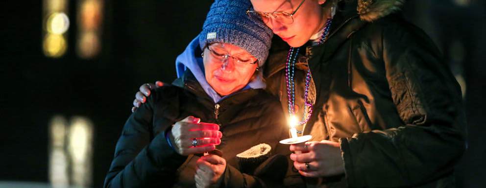 NEW HAVEN, CT - APRIL 3: Pam Shaw, mother of Rachael Shaw Rosenbaum, a Yale student who died by suicide last year in March 2021, attends a candlelight vigil organized by the group Elis for Rachael held on the New Haven Green. Comforting her is current Yale student Willow Sylvester, who met Shaw through Elis for Rachael, a group of Yale students, Yale alumni, and loved ones of Rachael Shaw-Rosenbaum that began meeting weekly via Zoom shortly after Rachael's passing to find a way to get much needed mental health reform on campus. The two had not met in person until the day of the vigil. (Photo by Stan Godlewski for the Washington Post)