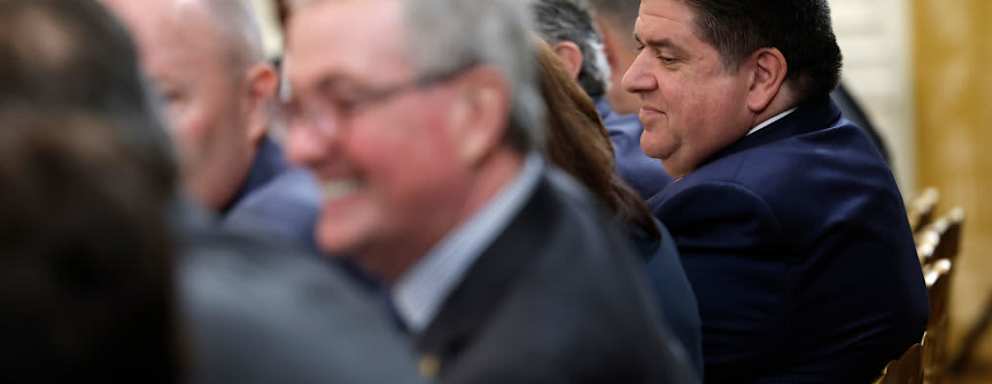 Illinois Governor J.B. Pritzker (R) speaks with other governors before the start of a meeting between U.S. President Joe Biden and governors visiting from states around the country in the East Room of the White House.