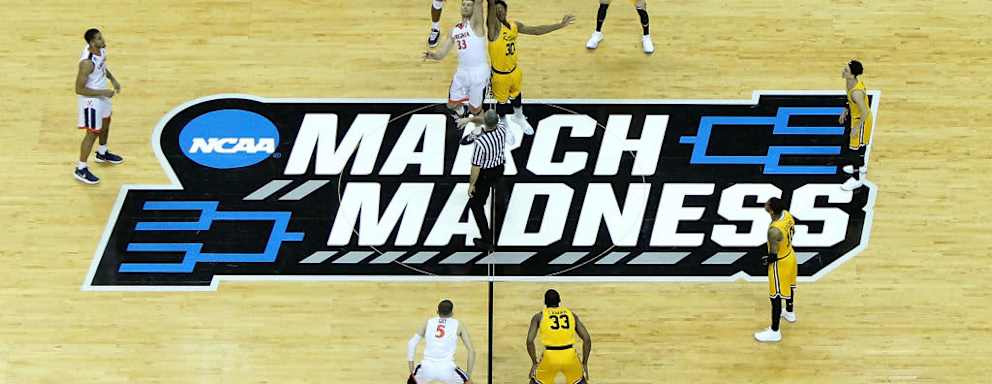 CHARLOTTE, NC - MARCH 16: The Virginia Cavaliers tip off against the UMBC Retrievers in the first round of the 2018 NCAA Men's Basketball Tournament at Spectrum Center on March 16, 2018 in Charlotte, North Carolina. (Photo by Streeter Lecka/Getty Images)