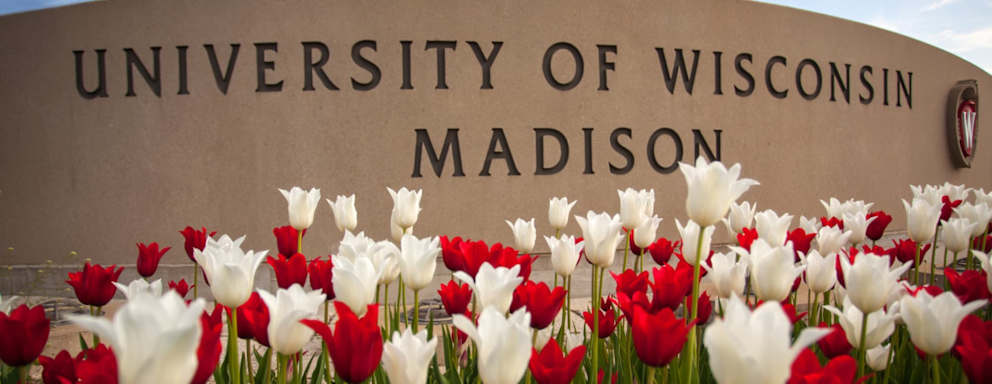 Madison, Wisconsin, USA - May 8, 2015: The University of Wisconsin crest and welcome sign is seen near the entrance to the UW Madison campus in Madison on May 8, 2015.