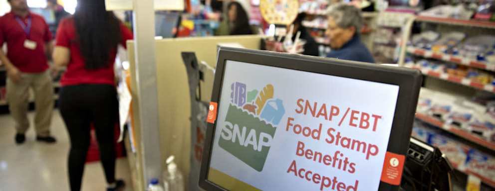"SNAP/EBT Food Stamp Benefits Accepted" is displayed on a screen inside a Family Dollar Stores Inc. store in Chicago, Illinois, U.S., on Tuesday, March 3, 2020. Dollar Tree Inc. released earnings figures on March 4. Photographer: Daniel Acker/Bloomberg via Getty Images