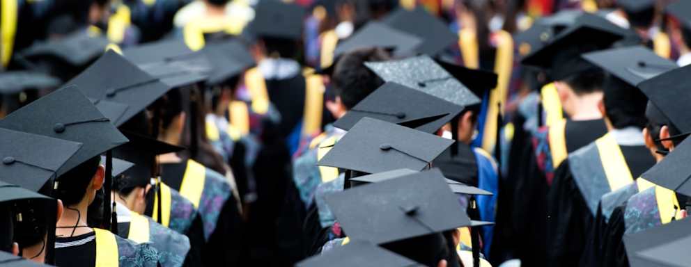 Shot of graduation caps during commencement.