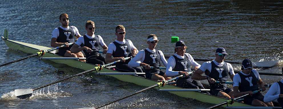 Members of the Yale championship eight crew team make their way up the Charles River