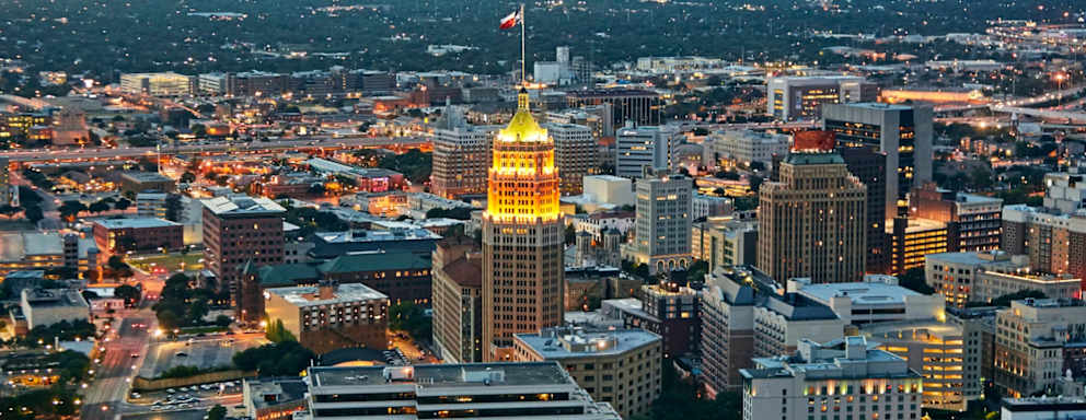 Aerial view of San Antonio illuminated at dusk