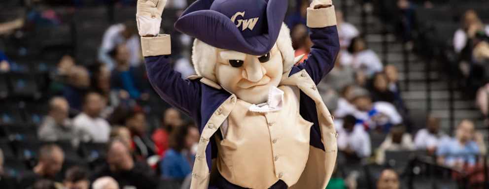 George Washington University's Colonials mascot cheering the team on during the second half of the Atlantic 10 basketball Tournament between the Colonials and the George Mason Patriots.