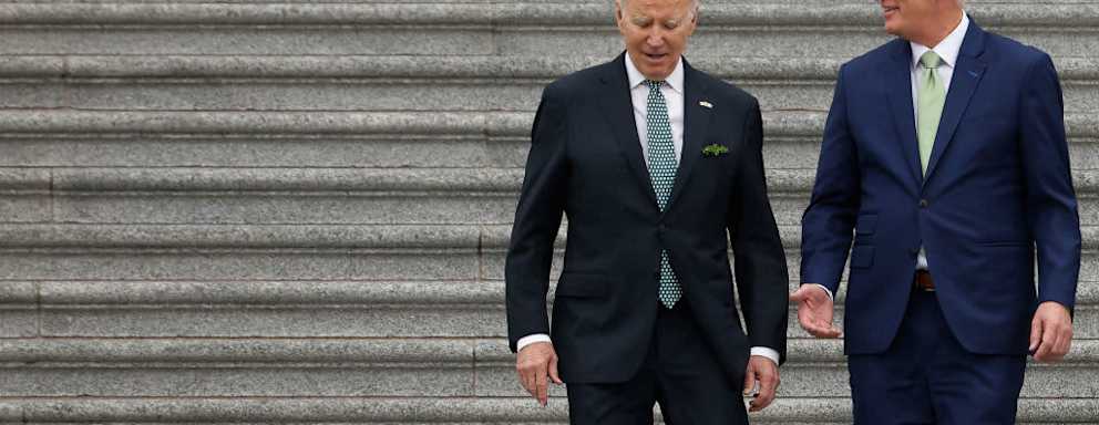 President Joe Biden and Speaker of the House Kevin McCarthy talk while walking out of the US Capitol