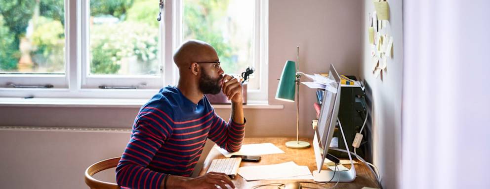 Online student working at his desk at home