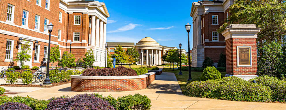Buildings surrounding the Shelby Quadrangle at the University of Alabama in Tuscaloosa, on a sunny spring day.