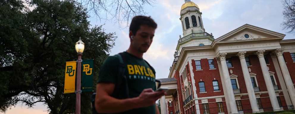 Student walking on Baylor University campus