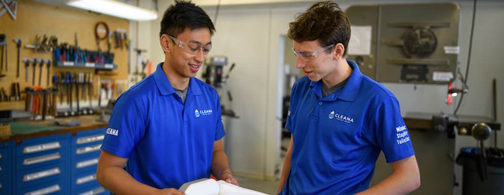 Cleana employees with their product.