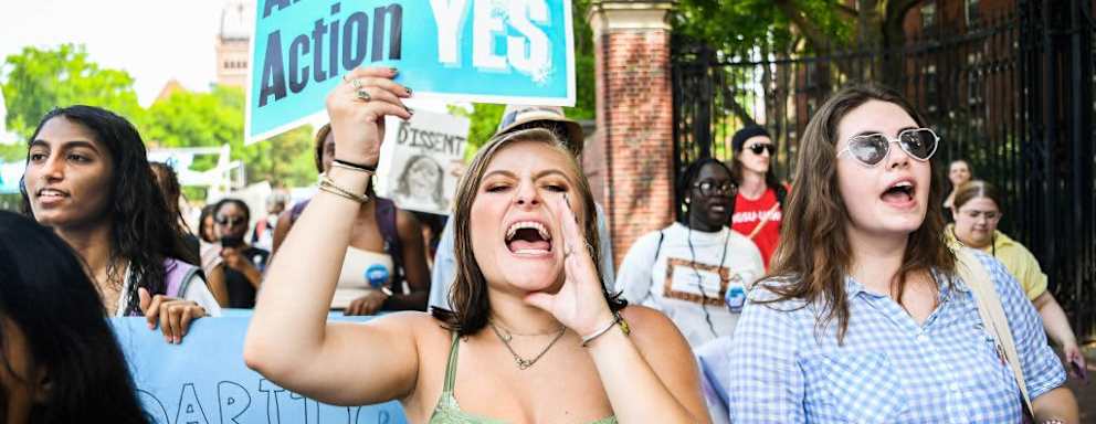Participants march and chant slogans at a rally protesting the Supreme Court's ruling against affirmative action on Harvard University Campus in Cambridge, Massachusetts, on July 1, 2023. The U.S. Supreme Court ruled that race-conscious admissions policies used by colleges and universities are unconstitutional, in a pair of cases involving Harvard University and the University of North Carolina at Chapel Hill. The Supreme Court stated that the admissions policies of Harvard and the University of North Carolina UNC, two of the oldest institutions of higher learning in the country, violated the equal protection clause of the 14th Amendment to the United States Constitution.