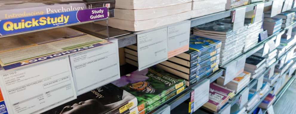 Stacks of college textbooks for sale in bookstore