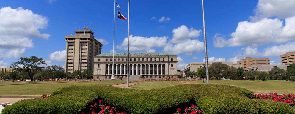 Flowers in front of the Jack K. Williams Systems Administration Building on the Texas A&M University campus in College Station.
