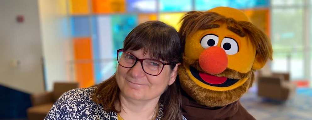 Little Frank, Marian University's Muppet student guide, poses with Sister Mary Beth of the Sisters of St. Francis of Oldenburg, at Marian University in Indianapolis, Indiana.