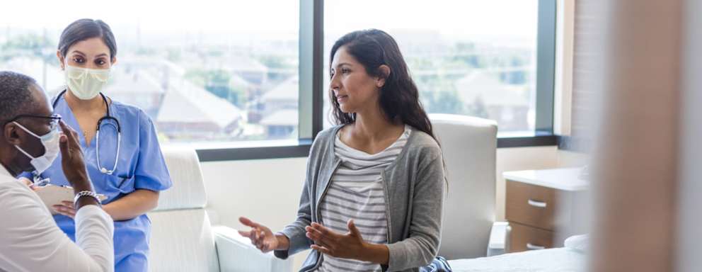 Bilingual patient talking to doctor and nurse
