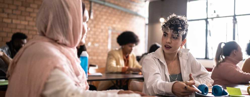 University students talking in class
