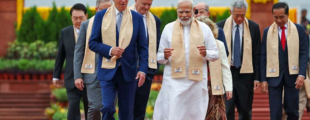 India's Prime Minister Narendra Modi (C), US President Joe Biden (L) along with world leaders arrive to pay their respect at the Mahatma Gandhi memorial