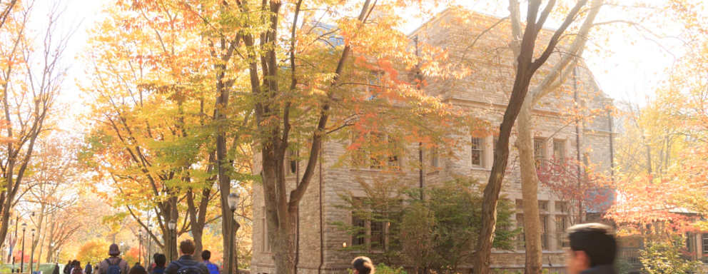 Students walking in autumn on University of Pennsylvania campus