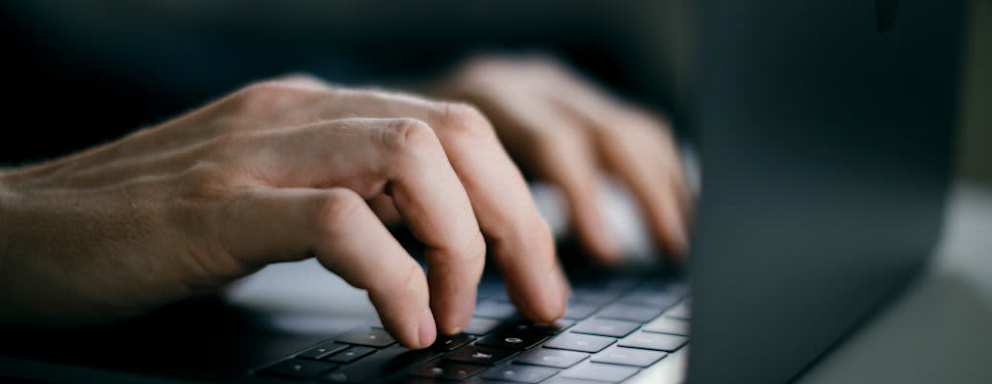 Human hands on a keyboard