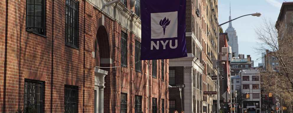 NYU flag on campus building