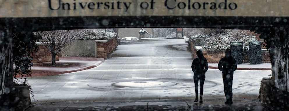 Students walk through the University of Colorado Boulder campus during a winter storm in Boulder, Colorado, on March 13, 2021.